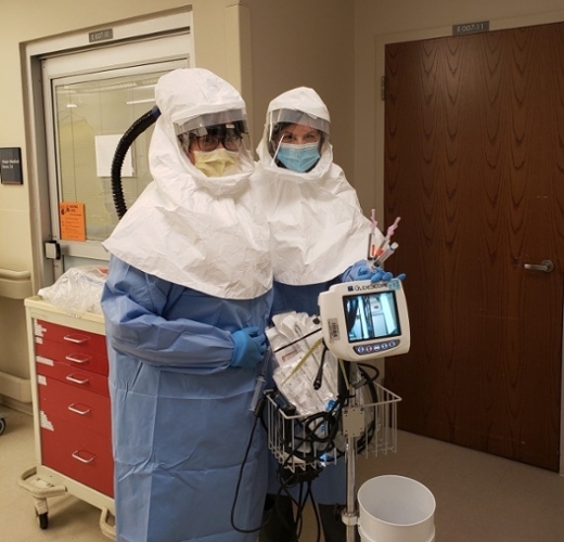 Drs. Mallory Brown and Risa Moriarity in full PPE